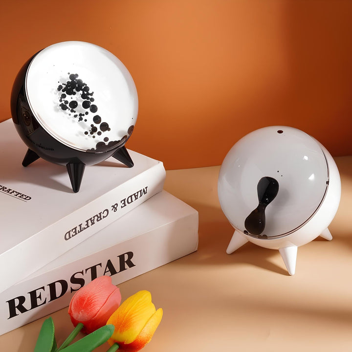 "Music-reactive ferrofluid display with black fluid art in motion, Bluetooth connectivity, and built-in lighting for tech lov