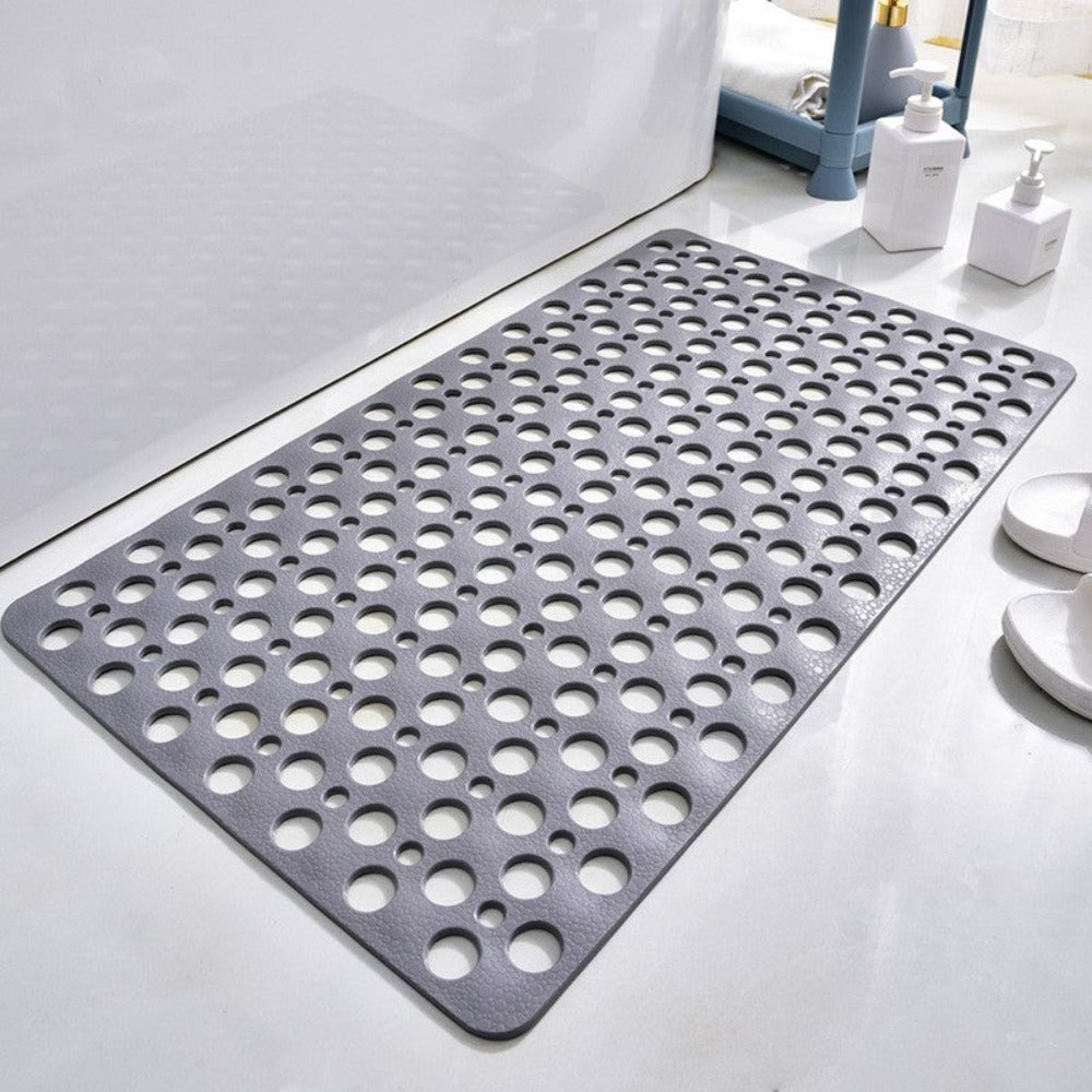 Non-slip shower mat with suction cups, textured for comfort, mold-resistant, in blue, green, grey; enhances bathroom safety.