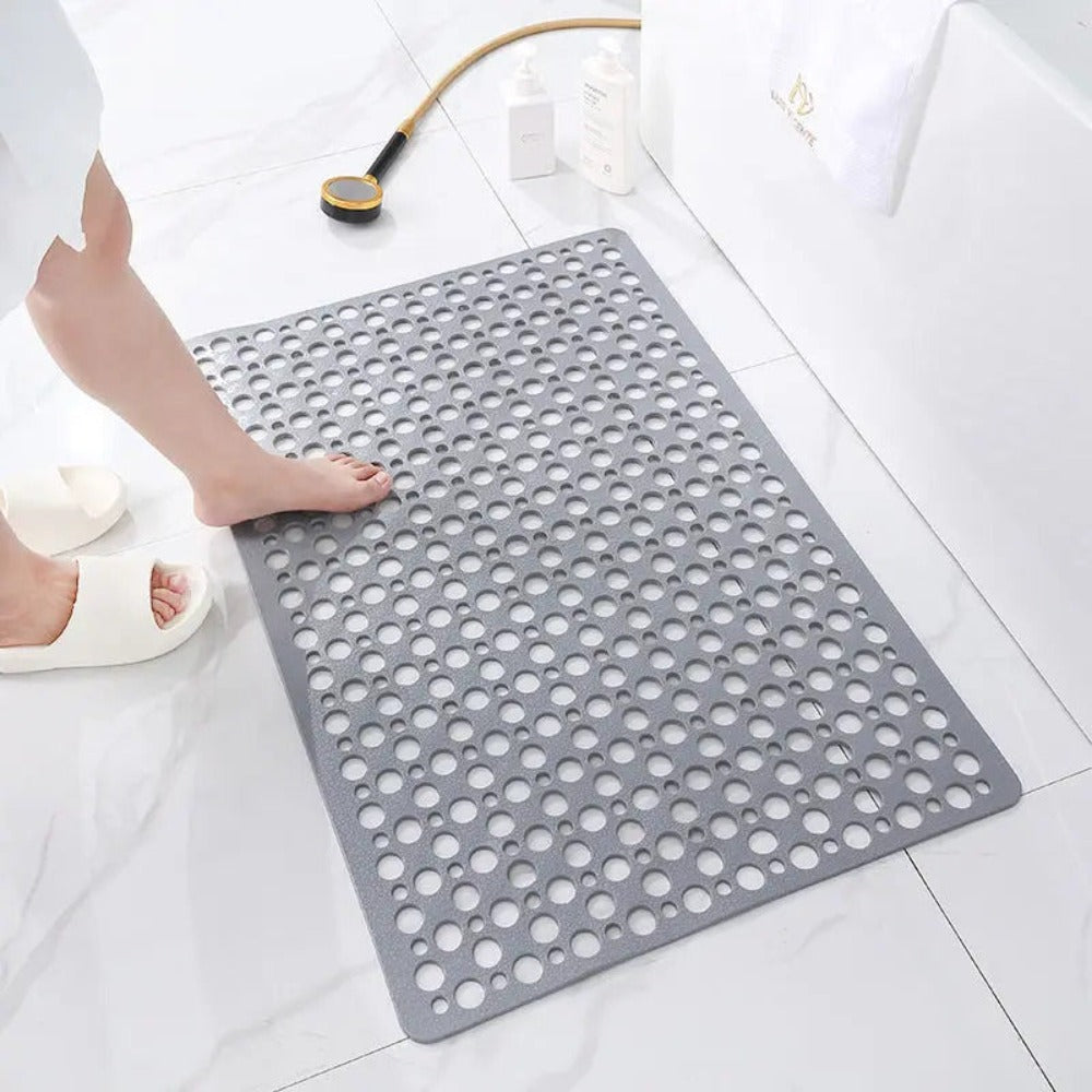 Non-slip shower mat with suction cups, textured for comfort, mold-resistant, in blue, green, grey; enhances bathroom safety.