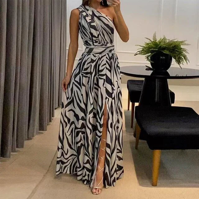 One-shoulder zebra print chiffon maxi dress with high slit, elegant and airy, perfect for summer events.