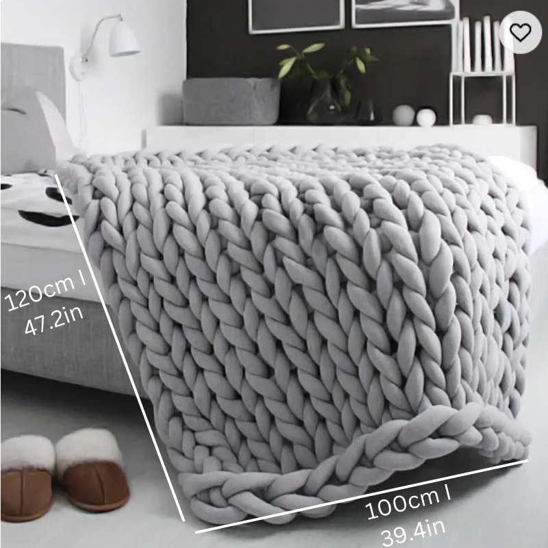"Organic cotton weighted blanket in grey, offering cozy warmth and therapeutic pressure for all seasons. Available in multipl
