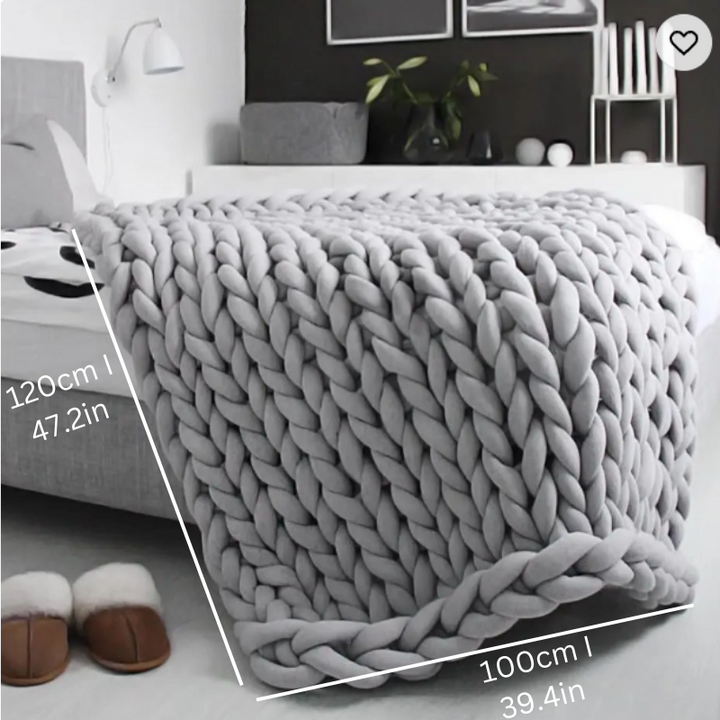 "Organic cotton weighted blanket in grey, offering cozy warmth and therapeutic pressure for all seasons. Available in multipl