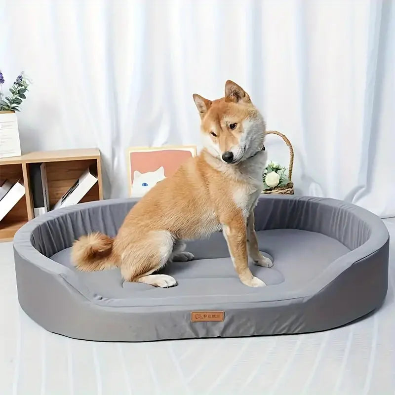 Orthopedic dog bed with memory foam for joint support, featuring a washable cover and non-slip base for optimal pet comfort.