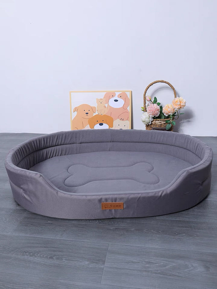 Orthopedic dog bed with memory foam for joint support, featuring a washable cover and non-slip base for optimal pet comfort.