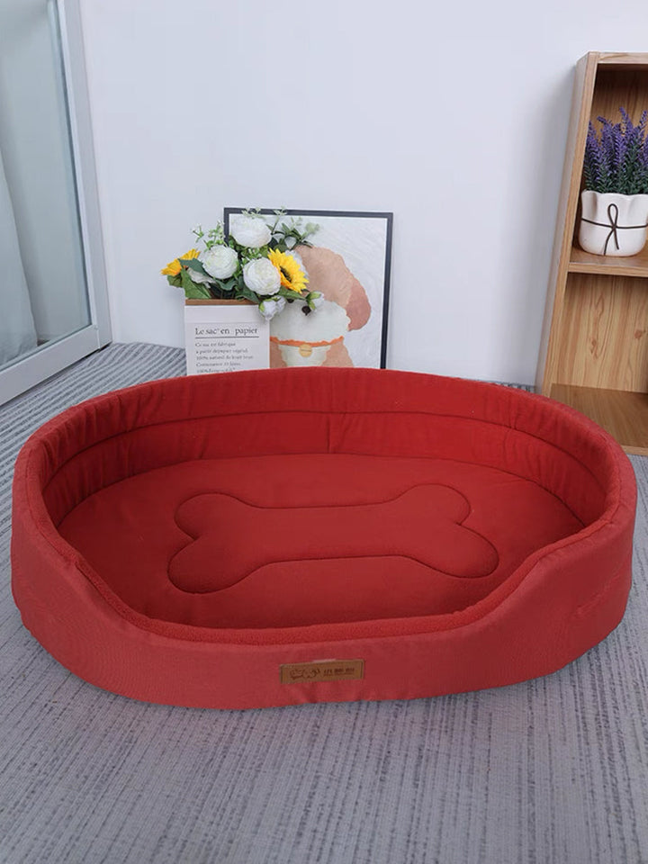 Orthopedic dog bed with memory foam for joint support, featuring a washable cover and non-slip base for optimal pet comfort.