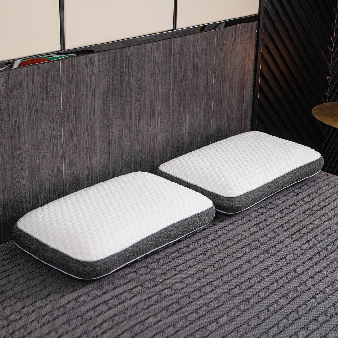 Orthopedic memory foam pillow offering pain-free sleep with ergonomic design and breathable cover for all sleep positions.