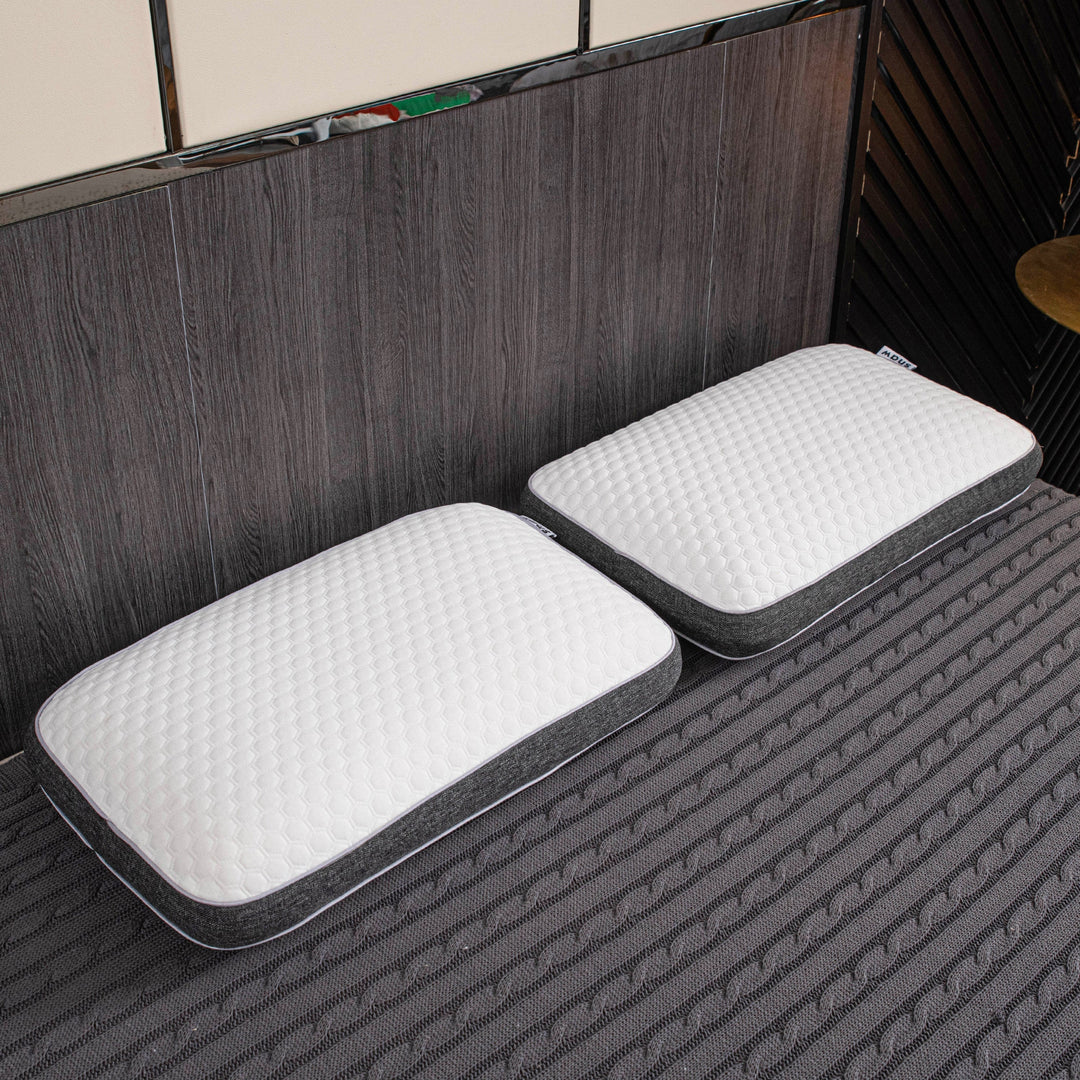 Orthopedic memory foam pillow offering pain-free sleep with ergonomic design and breathable cover for all sleep positions.