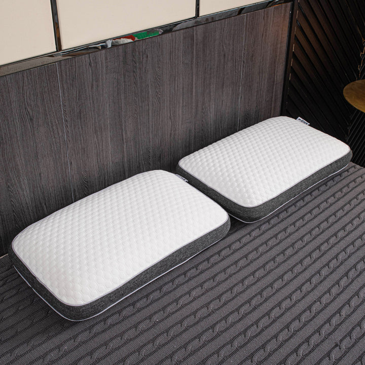 Orthopedic memory foam pillow offering pain-free sleep with ergonomic design and breathable cover for all sleep positions.