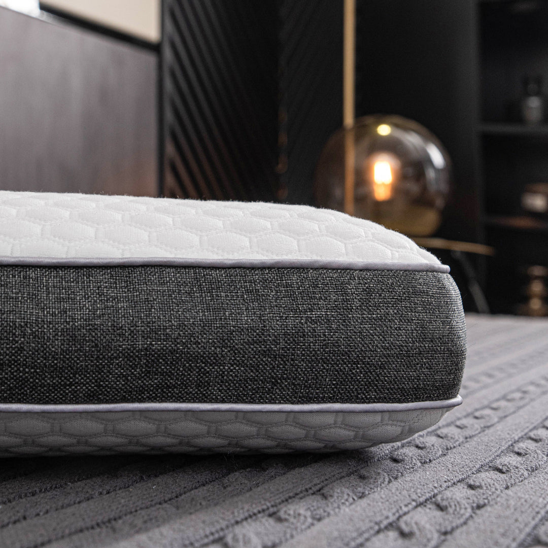 Orthopedic memory foam pillow offering pain-free sleep with ergonomic design and breathable cover for all sleep positions.