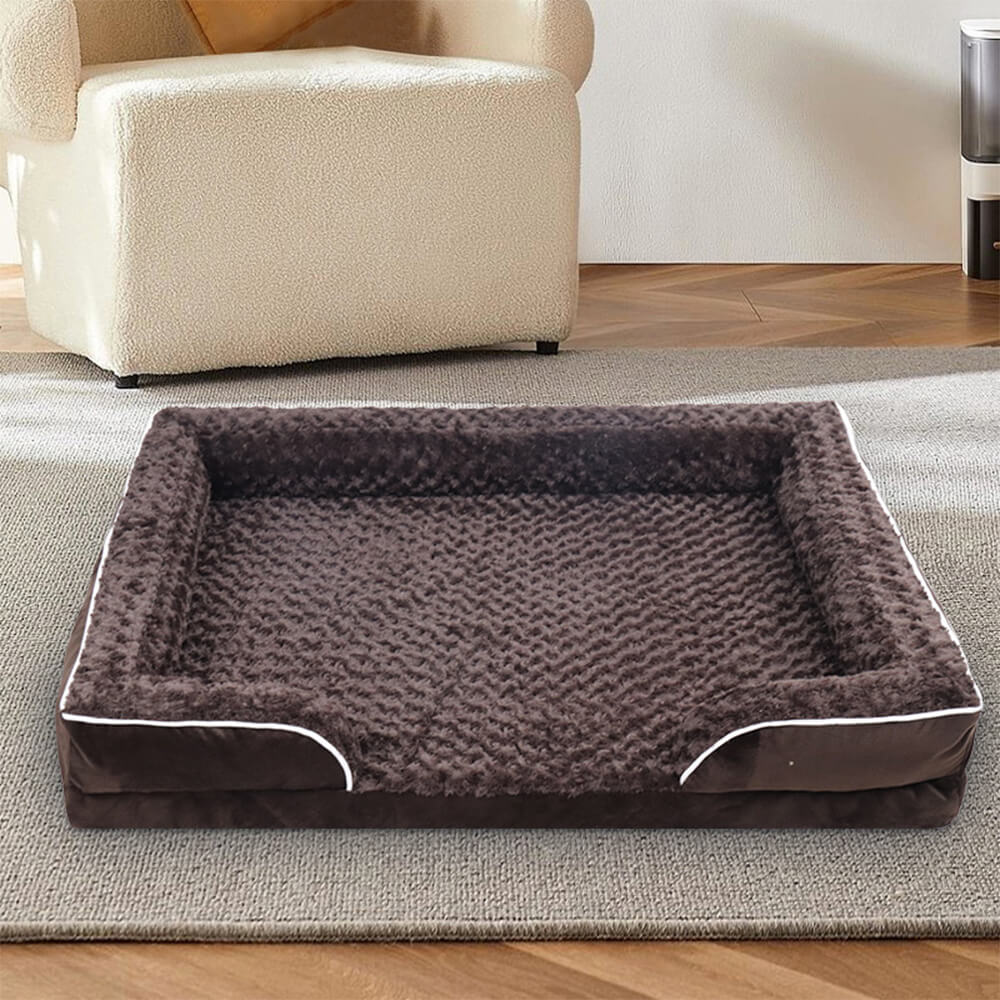 Orthopedic waterproof dog bed with thick foam base, raised edges, and plush cover for ultimate joint support and comfort.