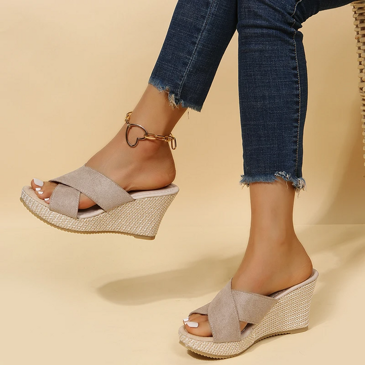 Orthopedic women's wedge sandals with braided strap and open-toe, offering comfort and style for summer outings.