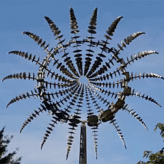 Outdoor anti-rust kinetic metal wind spinner with elegant wings, adds motion and charm to garden, perfect for year-round deco
