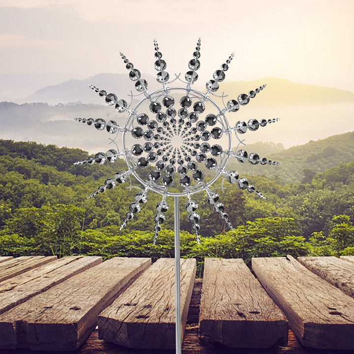 Outdoor anti-rust kinetic metal wind spinner with elegant wings, adds motion and charm to garden, perfect for year-round deco