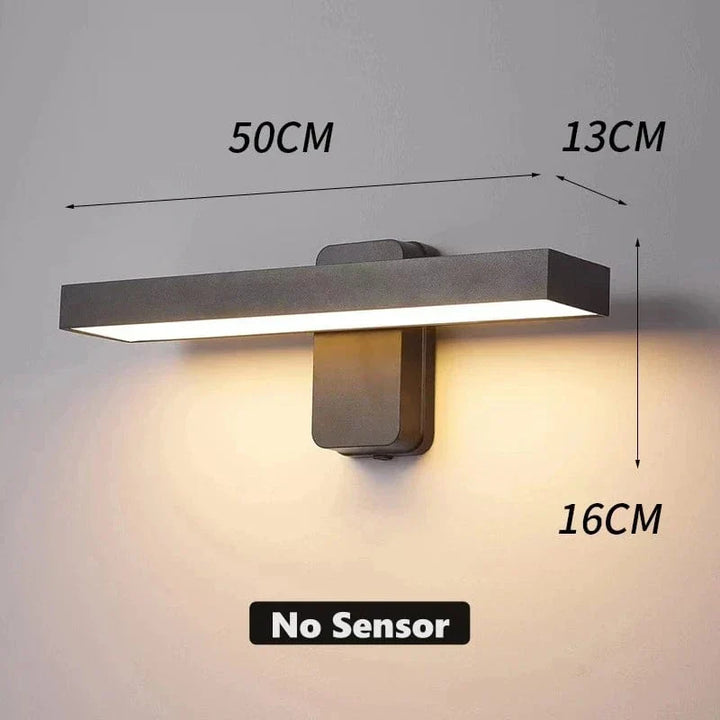 "Outdoor PIR motion sensor wall light, black aluminium, IP65 waterproof, rotatable design, warm white glow, modern style."
