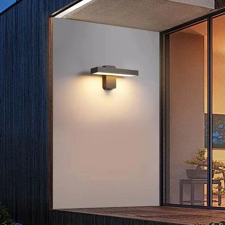 "Outdoor PIR motion sensor wall light, black aluminium, IP65 waterproof, rotatable design, warm white glow, modern style."