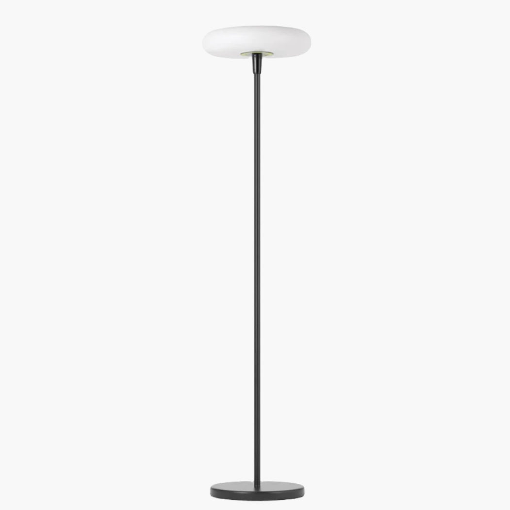 Outdoor solar floor lamp with metal and acrylic body, modern design, stands on patio illuminating with warm LED glow.