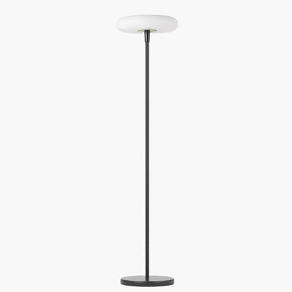 Outdoor solar floor lamp with metal and acrylic body, modern design, stands on patio illuminating with warm LED glow.