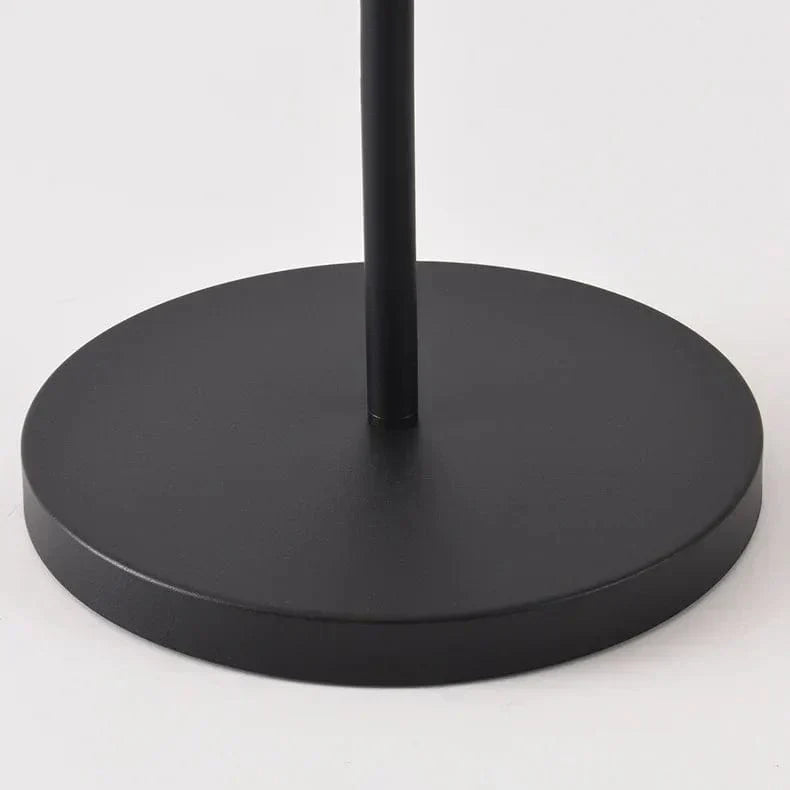 Outdoor solar floor lamp with metal and acrylic body, modern design, stands on patio illuminating with warm LED glow.
