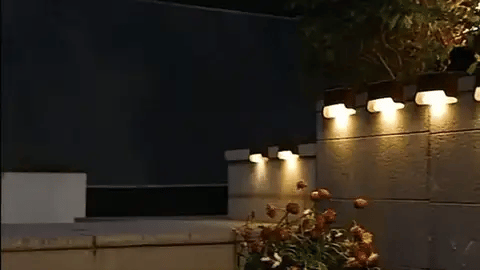 Outdoor Solar LED Wall Light with soft white glow, mounted on patio wall, weather-resistant, perfect for gardens and pathways