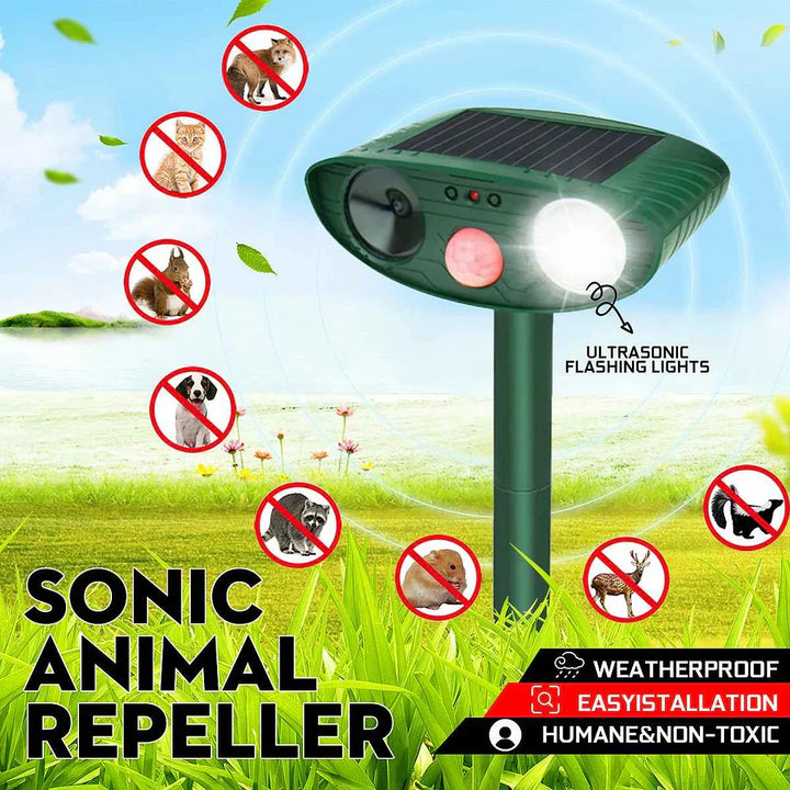 "Outdoor solar-powered ultrasonic deer repeller in garden setting, showcasing green and grey weather-resistant design."