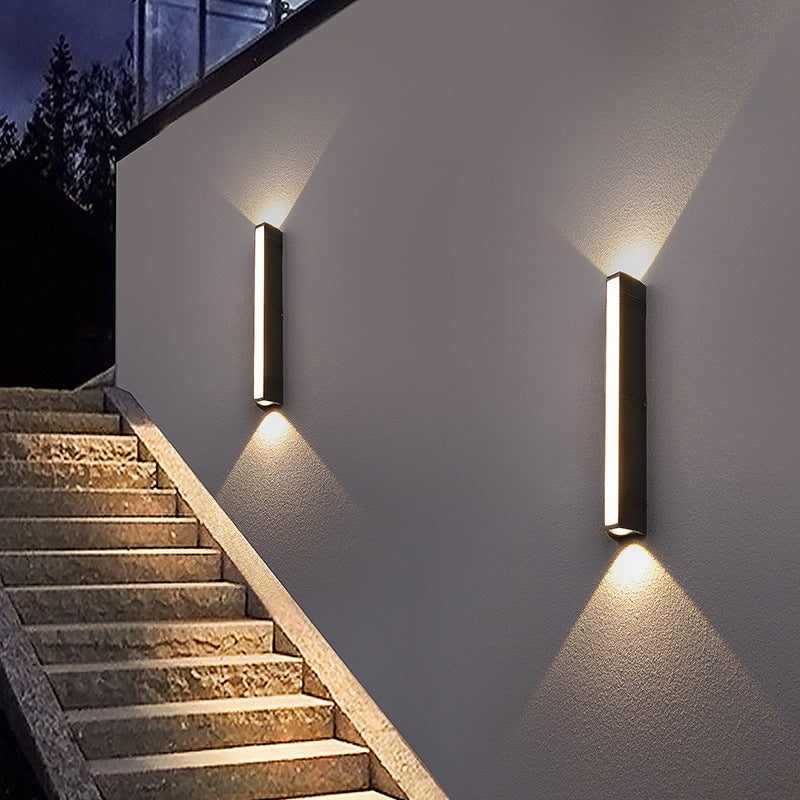 Outdoor wall light with LED technology, rustproof aluminum, sleek design, waterproof, ideal for garden or patio lighting.