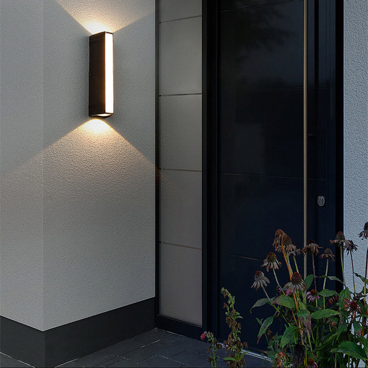Outdoor wall light with LED technology, rustproof aluminum, sleek design, waterproof, ideal for garden or patio lighting.