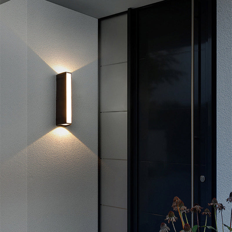 Outdoor wall light with LED technology, rustproof aluminum, sleek design, waterproof, ideal for garden or patio lighting.