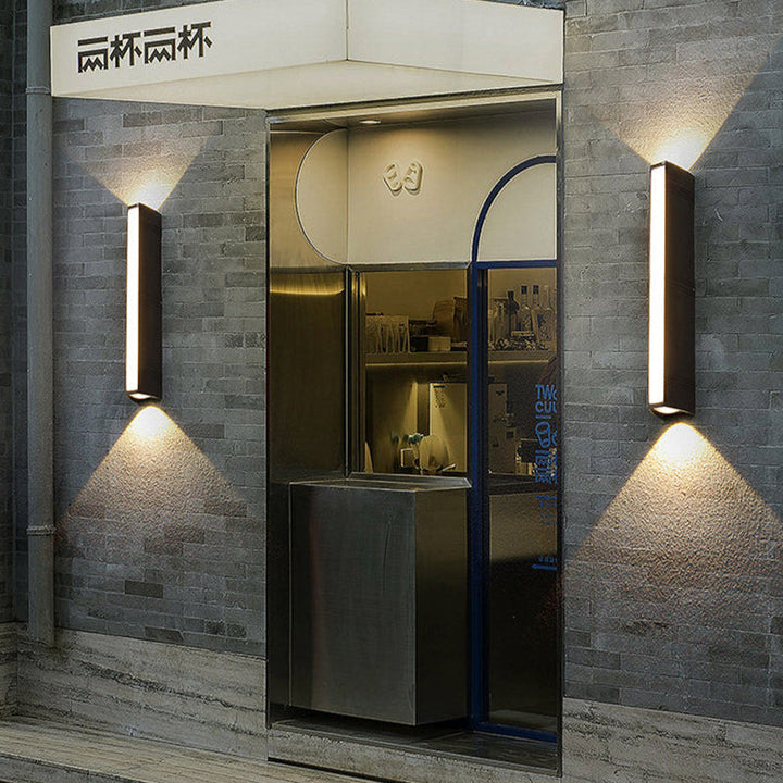 Outdoor wall light with LED technology, rustproof aluminum, sleek design, waterproof, ideal for garden or patio lighting.