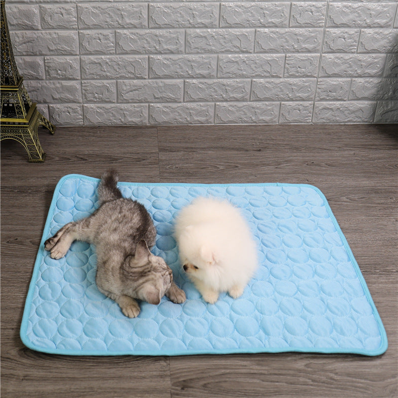 "Pet cooling pad in light blue, ideal for summer. Features breathable, machine-washable fabric, available in multiple sizes."