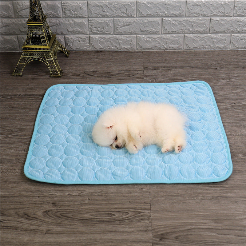 "Pet cooling pad in light blue, ideal for summer. Features breathable, machine-washable fabric, available in multiple sizes."