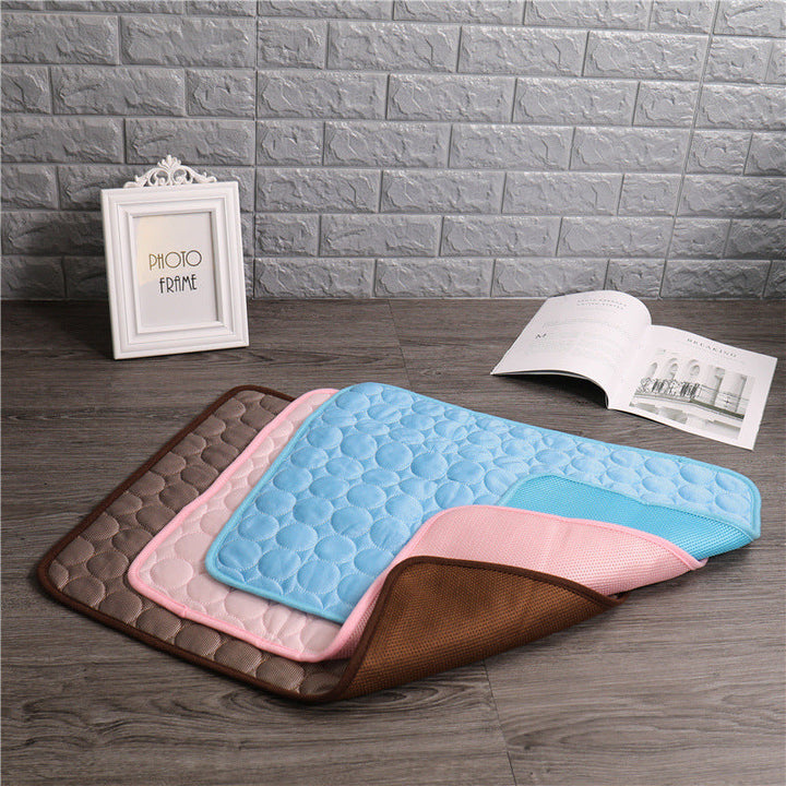 "Pet cooling pad in light blue, ideal for summer. Features breathable, machine-washable fabric, available in multiple sizes."