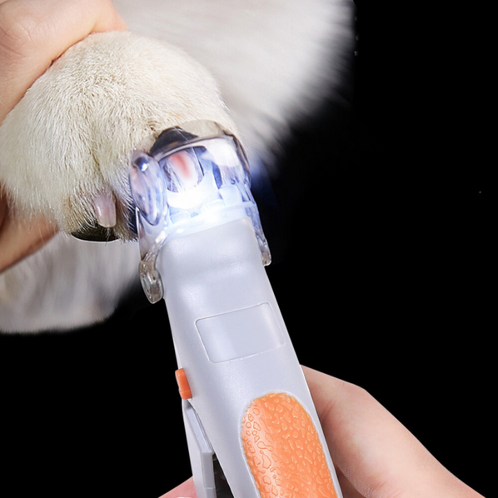 Pet nail clipper with LED light for safe grooming. Ergonomic design, bright lights for precision trimming. Pet supplies.