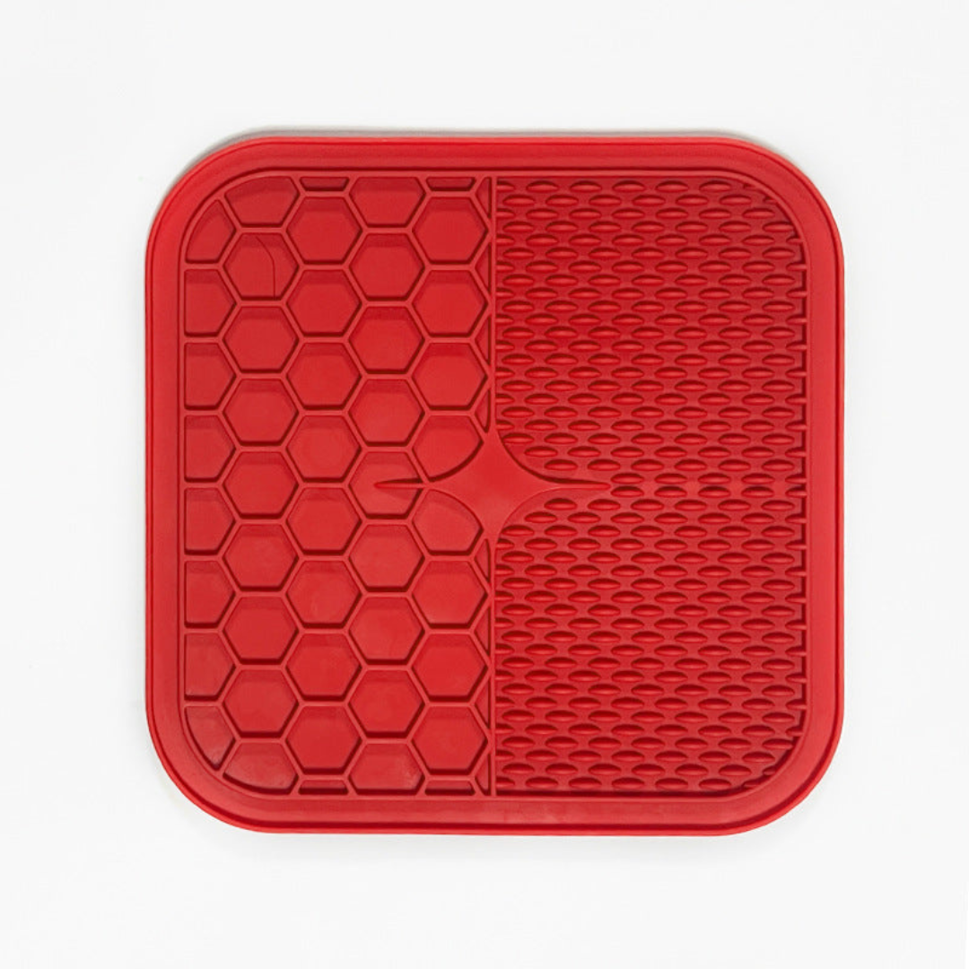 "Pet silicone lick mat in vibrant colors for stress relief and slow feeding; features textured surface for pets' wellness."
