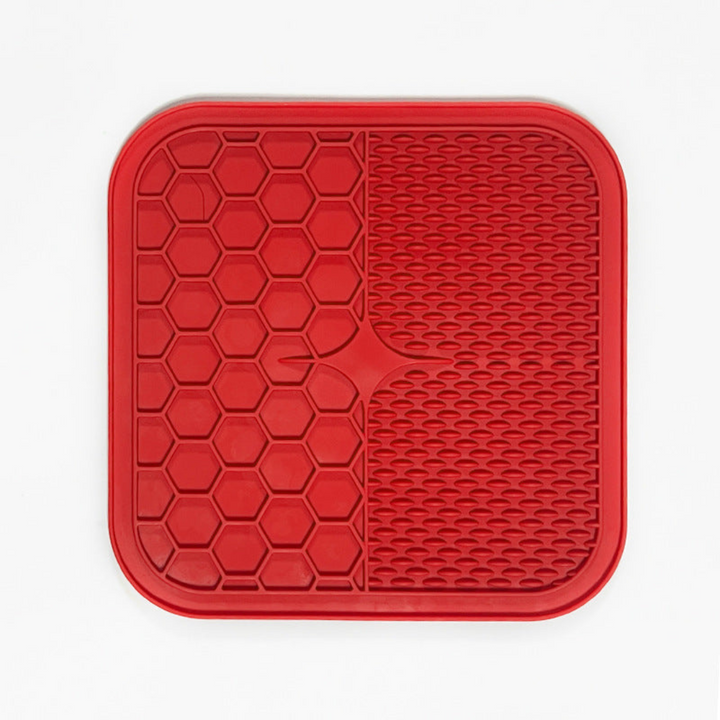 "Pet silicone lick mat in vibrant colors for stress relief and slow feeding; features textured surface for pets' wellness."