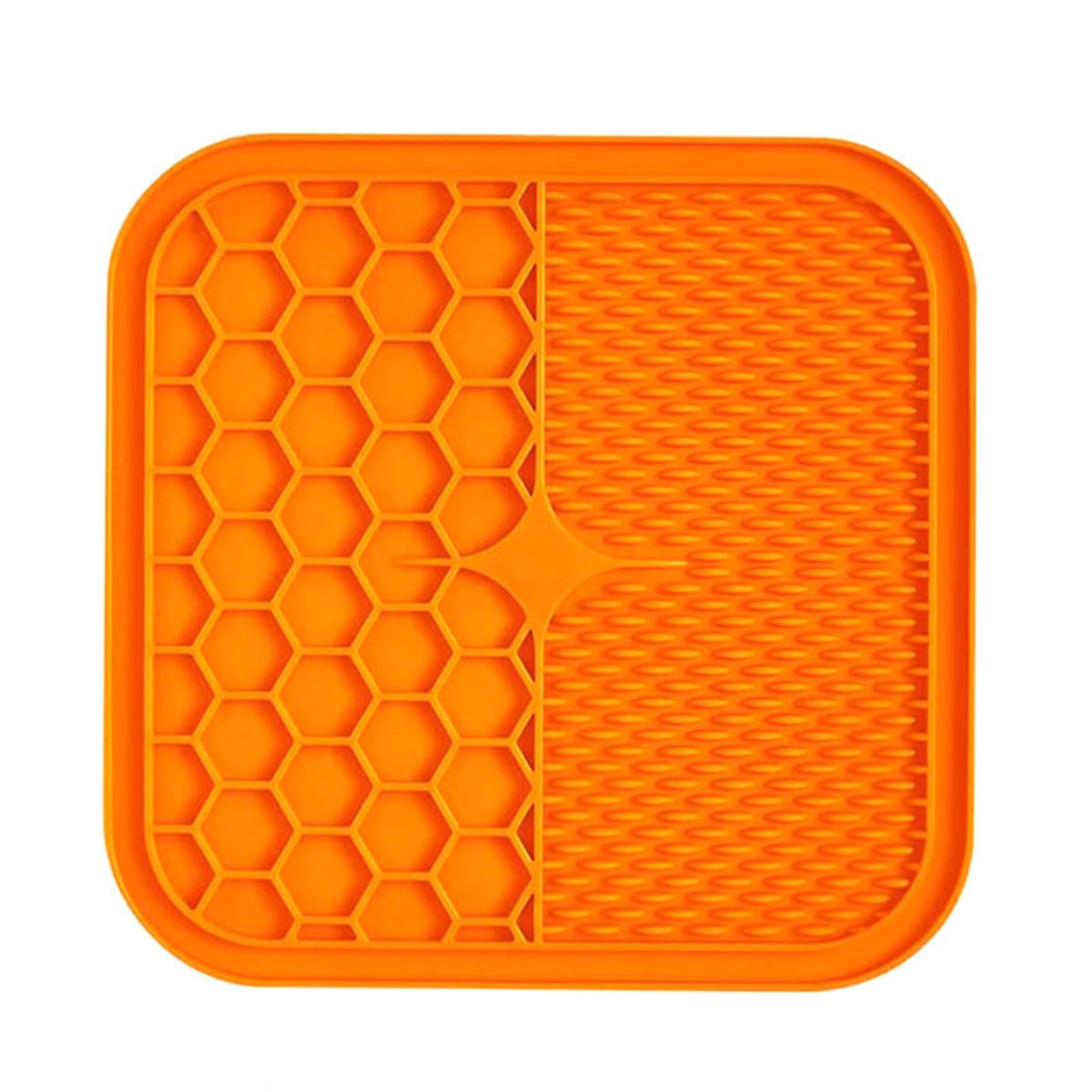 "Pet silicone lick mat in vibrant colors for stress relief and slow feeding; features textured surface for pets' wellness."