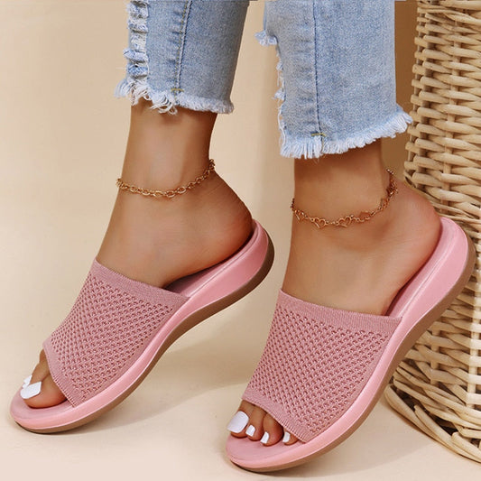 Pink women's breathable summer orthopedic slippers with adjustable straps and soft insoles for comfort and support.