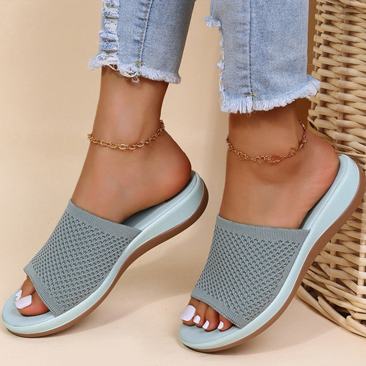 Pink women's breathable summer orthopedic slippers with adjustable straps and soft insoles for comfort and support.