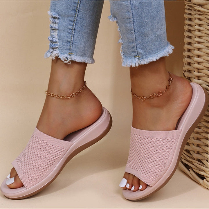 Pink women's breathable summer orthopedic slippers with adjustable straps and soft insoles for comfort and support.