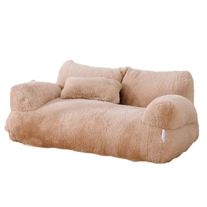 Plush cat sofa bed in pink, featuring soft material and raised edges for feline comfort and style, perfect for pet relaxation