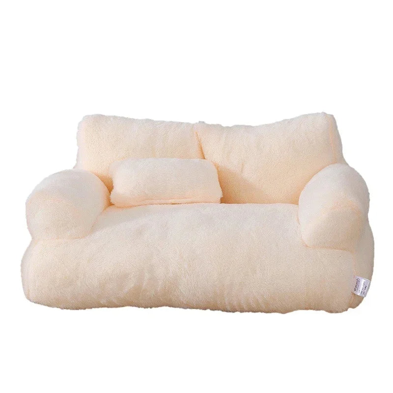 Plush cat sofa bed in pink, featuring soft material and raised edges for feline comfort and style, perfect for pet relaxation