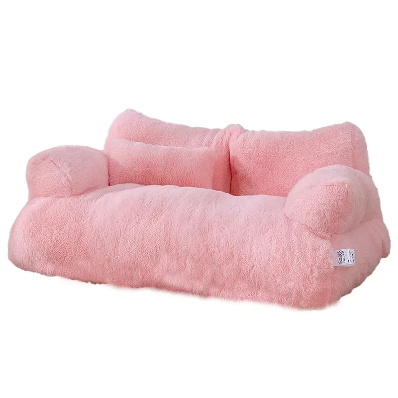Plush cat sofa bed in pink, featuring soft material and raised edges for feline comfort and style, perfect for pet relaxation