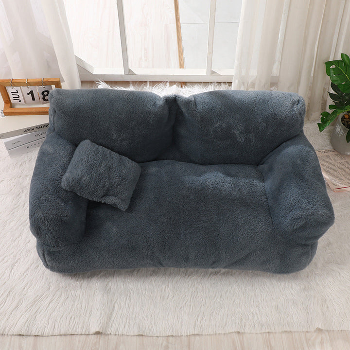 "Plush dog sofa bed in beige, features raised edges for security, soft cushioning for comfort, available in versatile sizes."