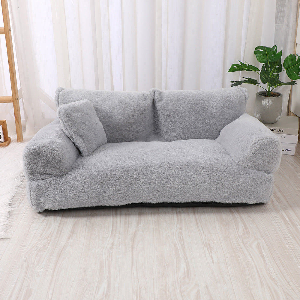 "Plush dog sofa bed in beige, features raised edges for security, soft cushioning for comfort, available in versatile sizes."