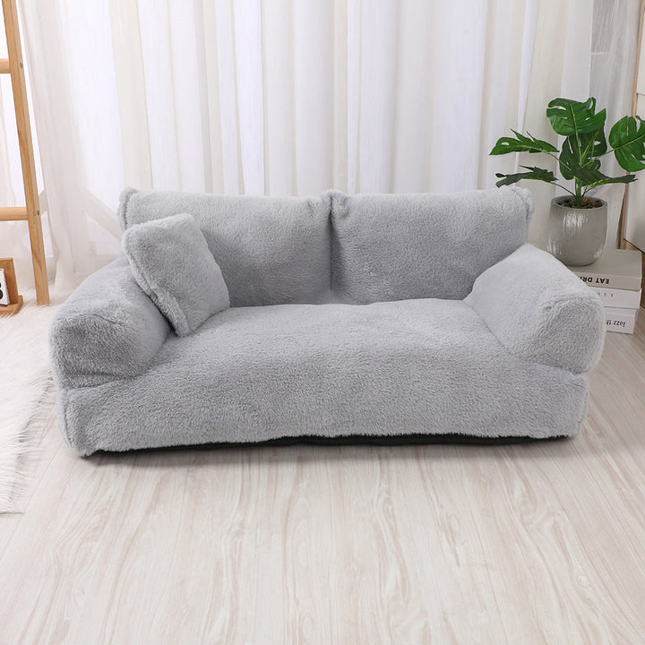 "Plush dog sofa bed in beige, features raised edges for security, soft cushioning for comfort, available in versatile sizes."