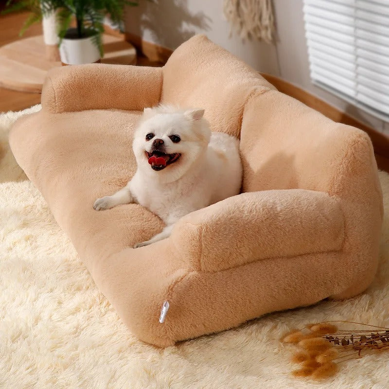 "Plush dog sofa bed in beige, features raised edges for security, soft cushioning for comfort, available in versatile sizes."