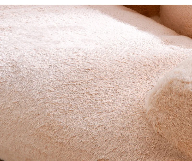 "Plush dog sofa bed in beige, features raised edges for security, soft cushioning for comfort, available in versatile sizes."