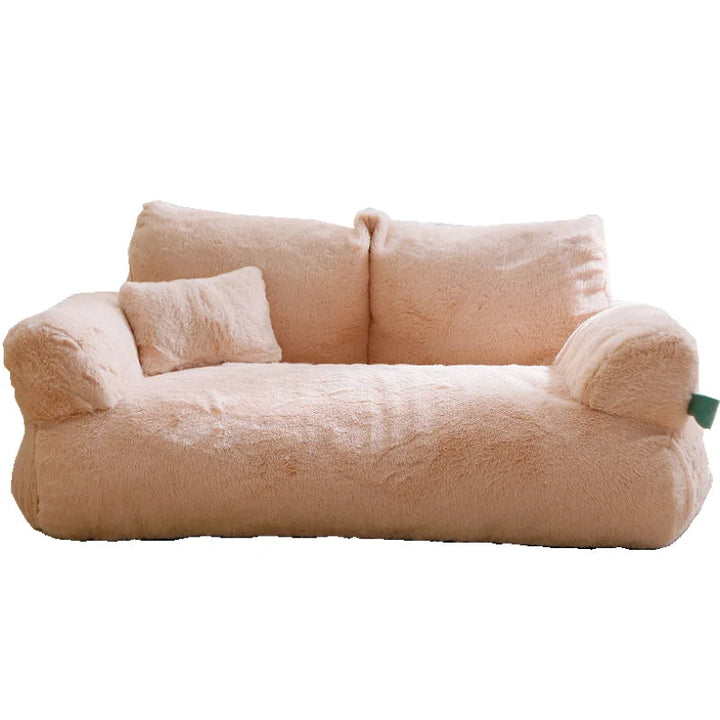"Plush dog sofa bed in beige, features raised edges for security, soft cushioning for comfort, available in versatile sizes."