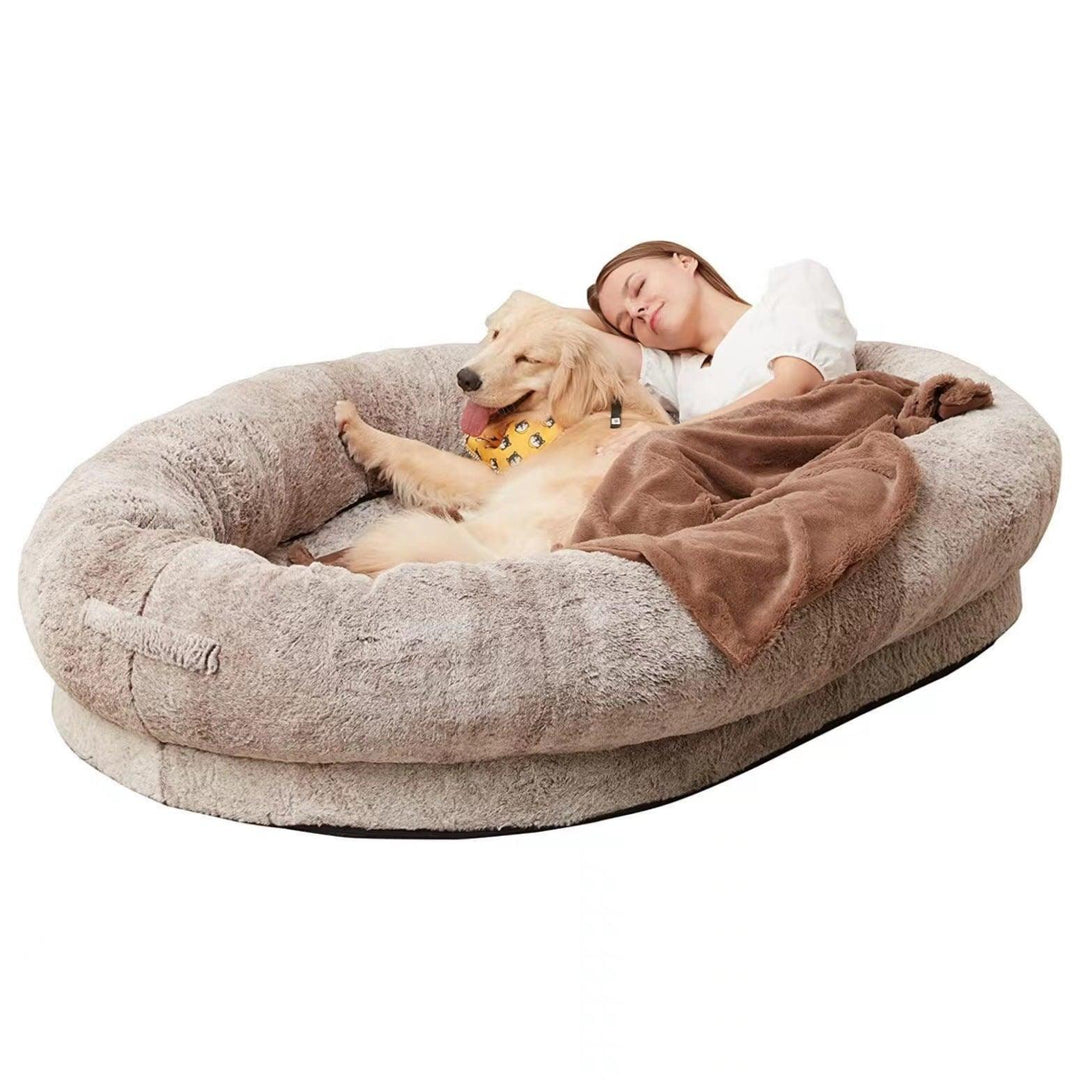 "Plush oversized lounger for pets and owners, featuring gray memory foam and plush bolsters for ultimate comfort and style."