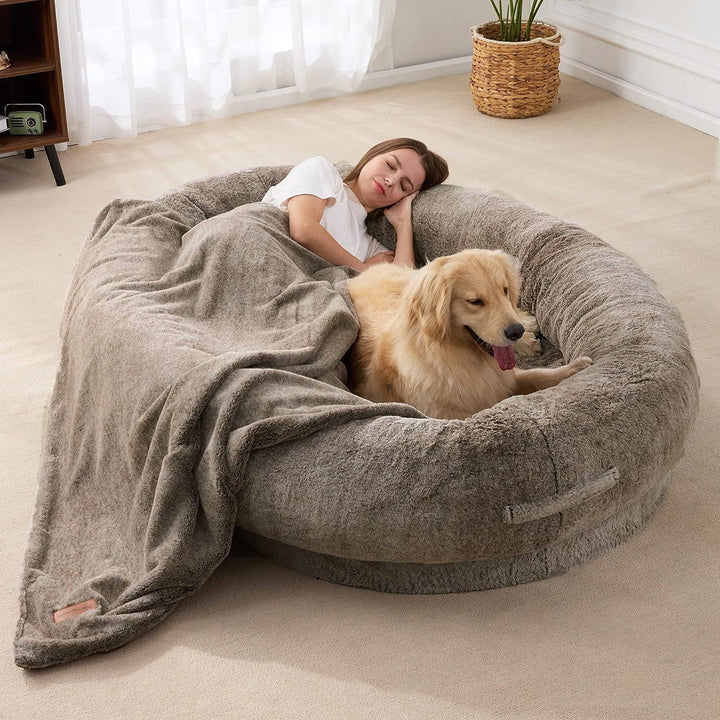 "Plush oversized lounger for pets and owners, featuring gray memory foam and plush bolsters for ultimate comfort and style."