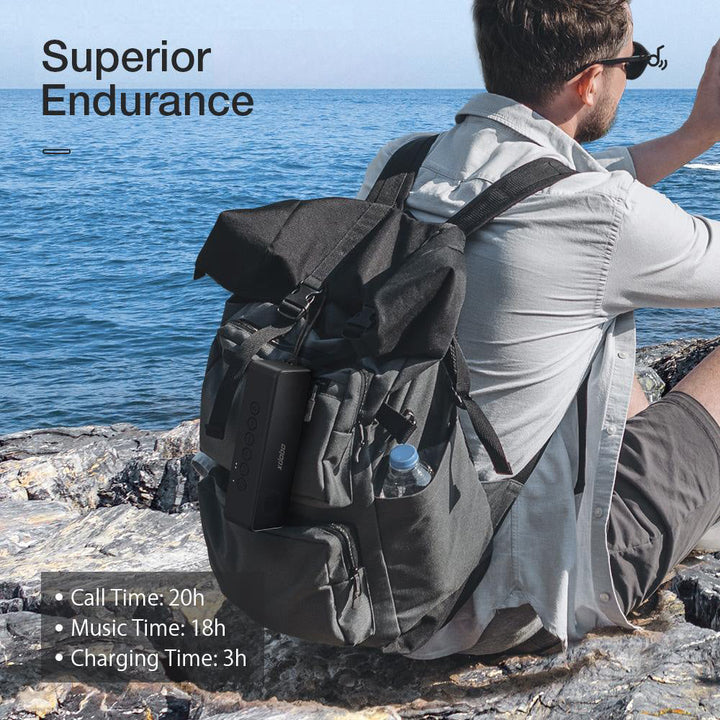 "Portable black waterproof 30W Bluetooth speaker with 4000mAh battery, dual drivers, compact for outdoor use."